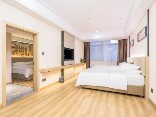 Imagen de la habitación del Hotel Country Inn & Suite by Radisson, Guiping Xishan. Foto 15