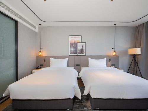 Imagen general del Hotel Country Inn & Suite by Radisson, Tianjin Wuqing Development Zone Wanda Plaza. Foto 2