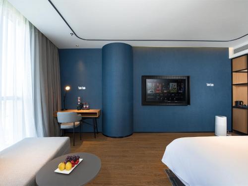 Imagen de la habitación del Hotel Country Inn & Suite by Radisson, Tianjin Wuqing Development Zone Wanda Plaza. Foto 9