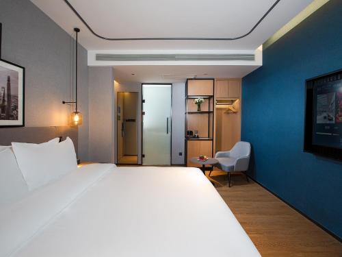 Imagen general del Hotel Country Inn & Suite by Radisson, Tianjin Wuqing Development Zone Wanda Plaza. Foto 7