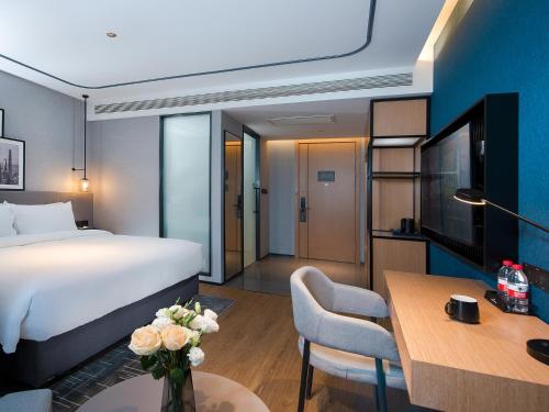 Imagen de la habitación del Hotel Country Inn & Suite by Radisson, Tianjin Wuqing Development Zone Wanda Plaza. Foto 10