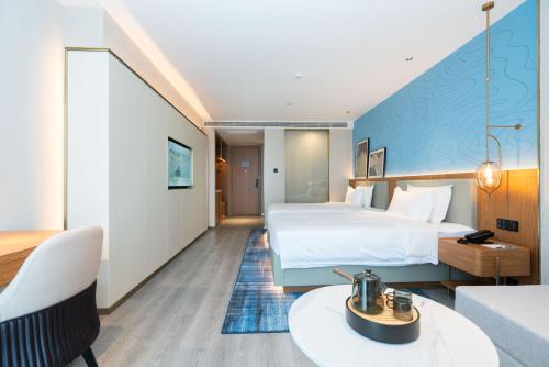 Imagen general del Hotel Country Inn & Suite by Radisson, Wuhan Optics Valley Technology Convention and Exhibition Center. Foto 1