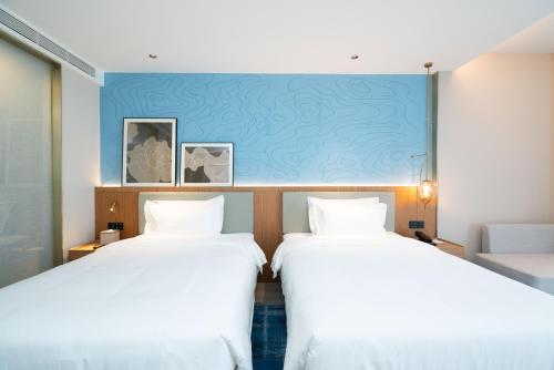 Imagen general del Hotel Country Inn & Suite by Radisson, Wuhan Optics Valley Technology Convention and Exhibition Center. Foto 3