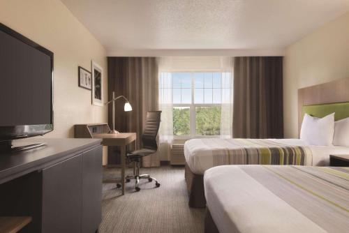 Imagen de la habitación del Hotel Country Inn & Suites By Radisson, Cottage Grove, MN. Foto 9