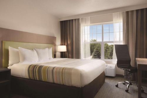 Imagen de la habitación del Hotel Country Inn & Suites By Radisson, Cottage Grove, MN. Foto 10