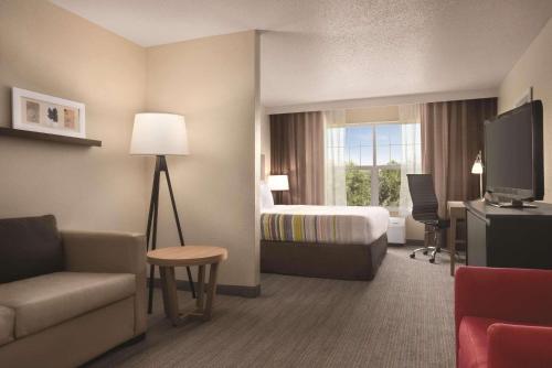 Imagen de la habitación del Hotel Country Inn & Suites By Radisson, Cottage Grove, MN. Foto 14