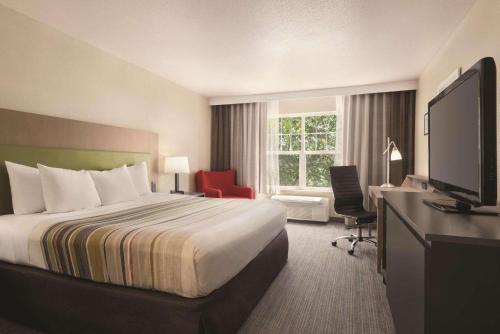Imagen de la habitación del Hotel Country Inn & Suites By Radisson, Cottage Grove, MN. Foto 16