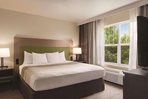 Imagen de la habitación del Hotel Country Inn & Suites By Radisson, Cottage Grove, MN. Foto 17