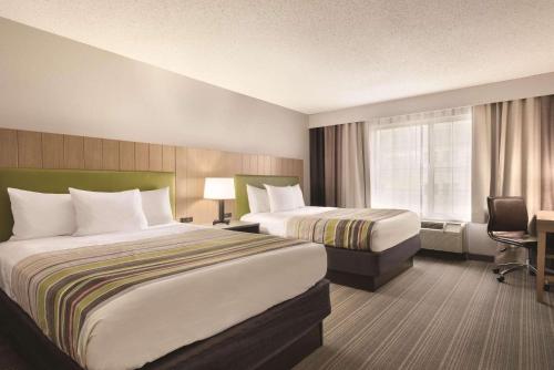 Imagen de la habitación del Hotel Country Inn & Suites By Radisson, Merrillville, In. Foto 11