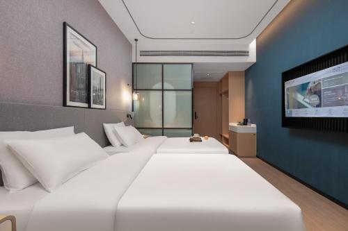 Imagen general del Hotel Country Inn & Suites by Radisson Dongfu Plaza. Foto 10