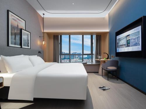 Imagen de la habitación del Hotel Country Inn & Suites by Radisson - Taishan East Branch. Foto 11