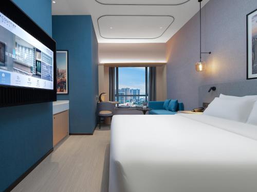 Imagen de la habitación del Hotel Country Inn & Suites by Radisson - Taishan East Branch. Foto 14