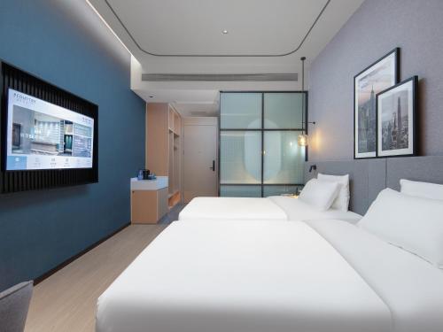 Imagen de la habitación del Hotel Country Inn & Suites by Radisson - Taishan East Branch. Foto 15