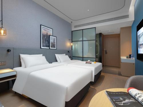 Imagen de la habitación del Hotel Country Inn & Suites by Radisson - Taishan East Branch. Foto 16
