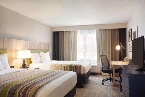 Imagen de la habitación del Hotel Country Inn and Suites By Radisson Lawrence. Foto 15