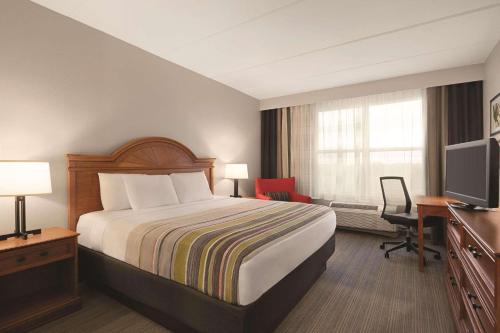 Imagen de la habitación del Hotel Country Inn and Suites By Radisson, Orlando Airport, Fl. Foto 14