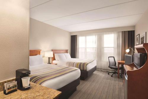Imagen de la habitación del Hotel Country Inn and Suites By Radisson, Orlando Airport, Fl. Foto 15
