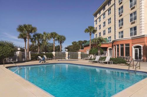 Imagen de la piscina del Hotel Country Inn and Suites By Radisson, Orlando Airport, Fl. Foto 20