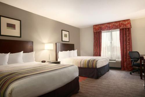 Imagen de la habitación del Hotel Country Inn and Suites by Radisson, Dearborn. Foto 13