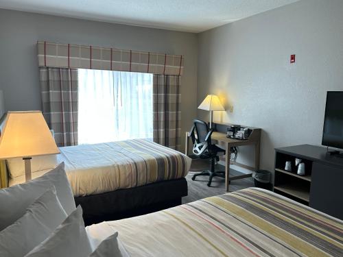 Imagen de la habitación del Hotel Country Inn and Suites by Radisson, Grand Rapids Airport, MI. Foto 13