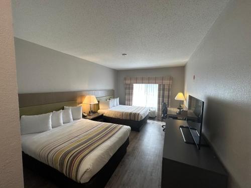 Imagen de la habitación del Hotel Country Inn and Suites by Radisson, Grand Rapids Airport, MI. Foto 16