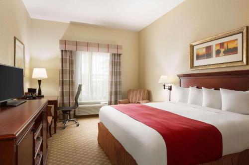 Imagen de la habitación del Hotel Country Inn and Suites by Radisson, Macon North, GA. Foto 17