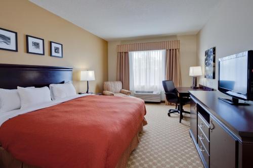 Imagen de la habitación del Hotel Country Inn and Suites by Radisson, Port Orange-Daytona, FL. Foto 10