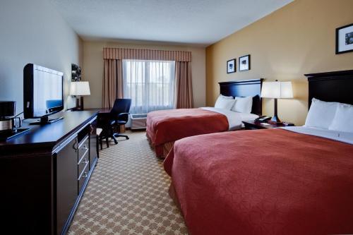 Imagen de la habitación del Hotel Country Inn and Suites by Radisson, Port Orange-Daytona, FL. Foto 11