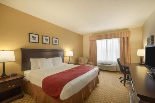 Imagen de la habitación del Hotel Country Inn and Suites by Radisson, Port Orange-Daytona, FL. Foto 13
