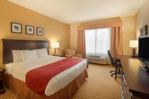Imagen de la habitación del Hotel Country Inn and Suites by Radisson, Port Orange-Daytona, FL. Foto 15