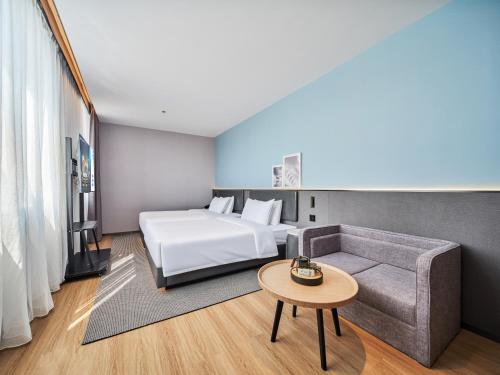 Imagen de la habitación del Hotel Country Inn&Suites By Radisson, Xi'an Bell and Drum Tower Flagship. Foto 7