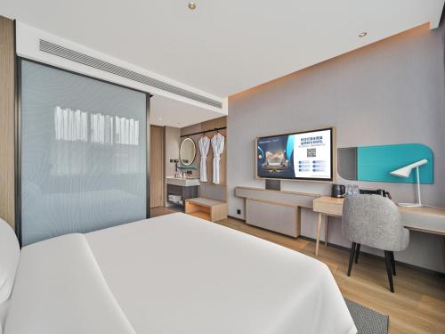 Imagen de la habitación del Hotel Country Inn&Suites By Radisson, Xi'an Bell and Drum Tower Flagship. Foto 9