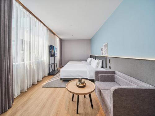 Imagen de la habitación del Hotel Country Inn&Suites By Radisson, Xi'an Bell and Drum Tower Flagship. Foto 10