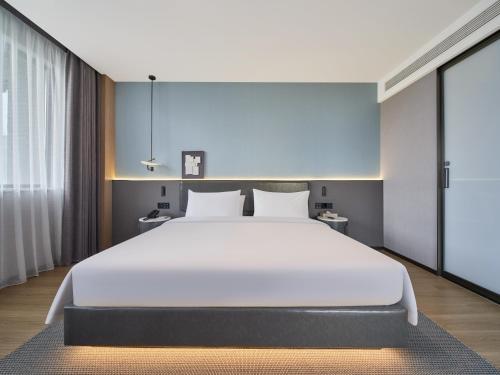 Imagen de la habitación del Hotel Country Inn&Suites By Radisson, Xi'an Bell and Drum Tower Flagship. Foto 12