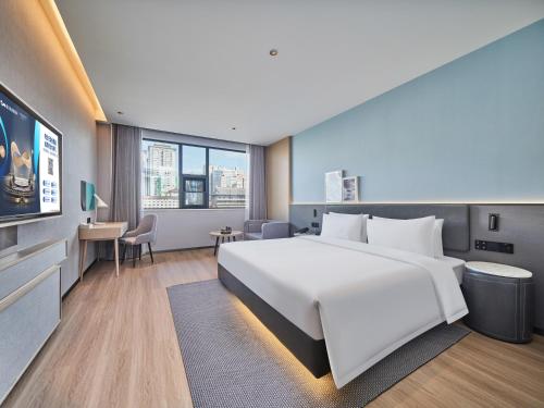 Imagen de la habitación del Hotel Country Inn&Suites By Radisson, Xi'an Bell and Drum Tower Flagship. Foto 13
