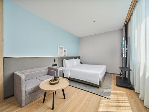 Imagen de la habitación del Hotel Country Inn&Suites By Radisson, Xi'an Bell and Drum Tower Flagship. Foto 16
