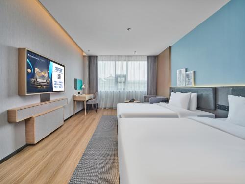 Imagen de la habitación del Hotel Country Inn&Suites By Radisson, Xi'an Bell and Drum Tower Flagship. Foto 18