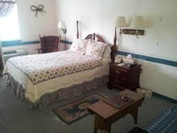 Imagen de la habitación del Hotel Country Living Inn. Foto 14