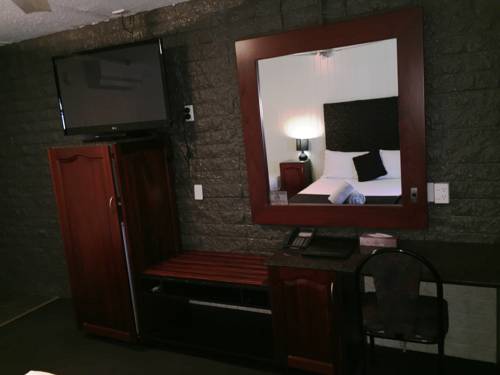 Imagen de la habitación del Hotel Country Plaza Motor Inn. Foto 5