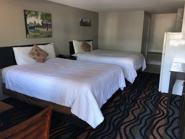 Imagen de la habitación del Hotel Country Town N Suites. Foto 9