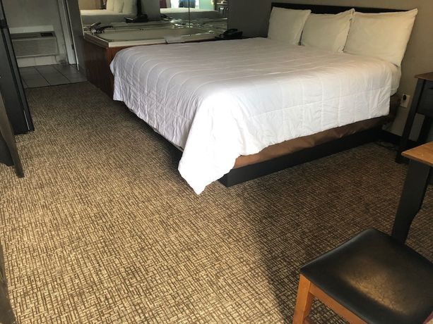 Imagen de la habitación del Hotel Country Town N Suites. Foto 11