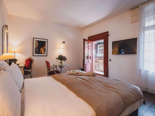 Imagen de la habitación del Hotel Cour Du Corbeau Strasbourg - Mgallery. Foto 9