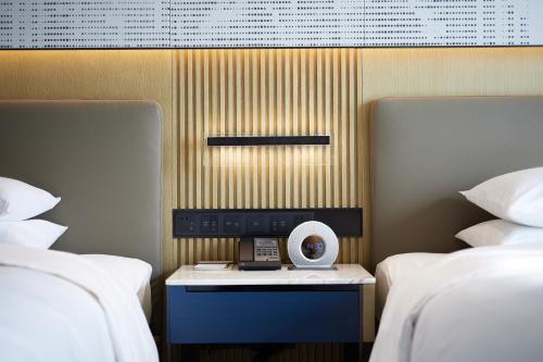 Imagen de la habitación del Hotel Courtyard By Marriott Beijing Changping. Foto 8