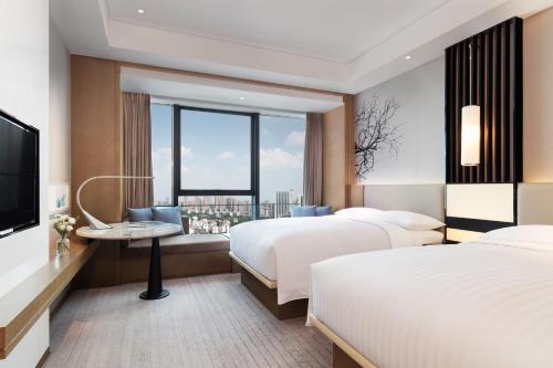 Imagen de la habitación del Hotel Courtyard By Marriott Changsha South. Foto 7
