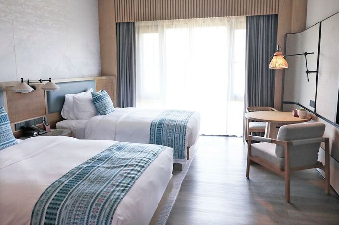 Imagen de la habitación del Hotel Courtyard By Marriott Liuzhou Sanjiang. Foto 18