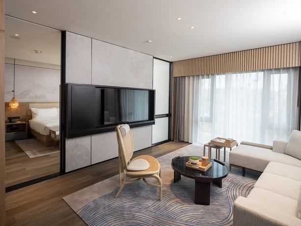Imagen de la habitación del Hotel Courtyard By Marriott Liuzhou Sanjiang. Foto 9