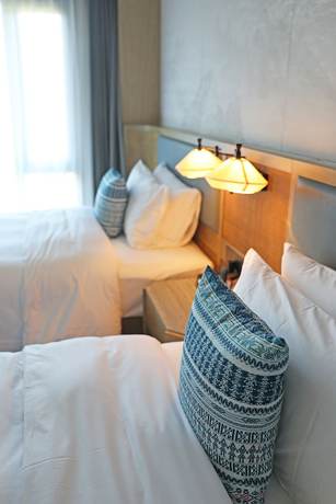 Imagen de la habitación del Hotel Courtyard By Marriott Liuzhou Sanjiang. Foto 13