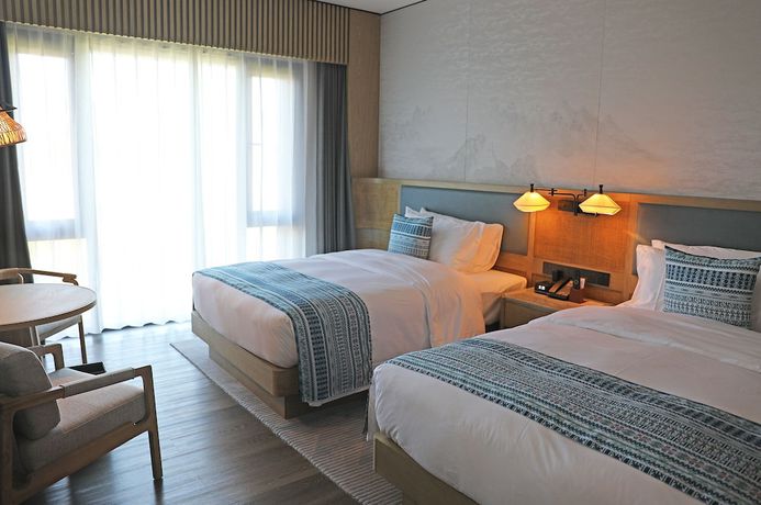 Imagen de la habitación del Hotel Courtyard By Marriott Liuzhou Sanjiang. Foto 14