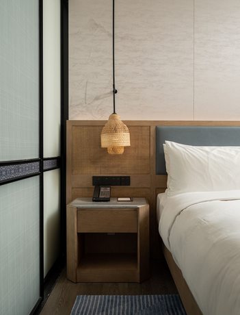 Imagen de la habitación del Hotel Courtyard By Marriott Liuzhou Sanjiang. Foto 16