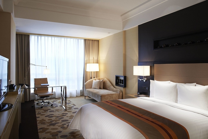 Imagen de la habitación del Hotel Courtyard By Marriott Shanghai Central. Foto 7